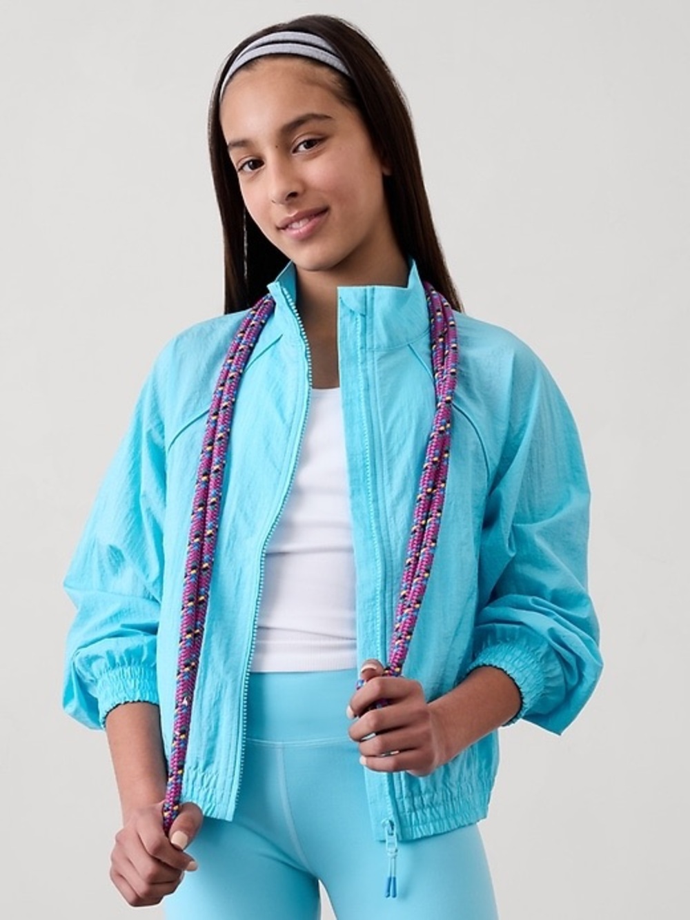 Athleta Girls Daybreak Zip-Up Jacket in Aqua Blue.
